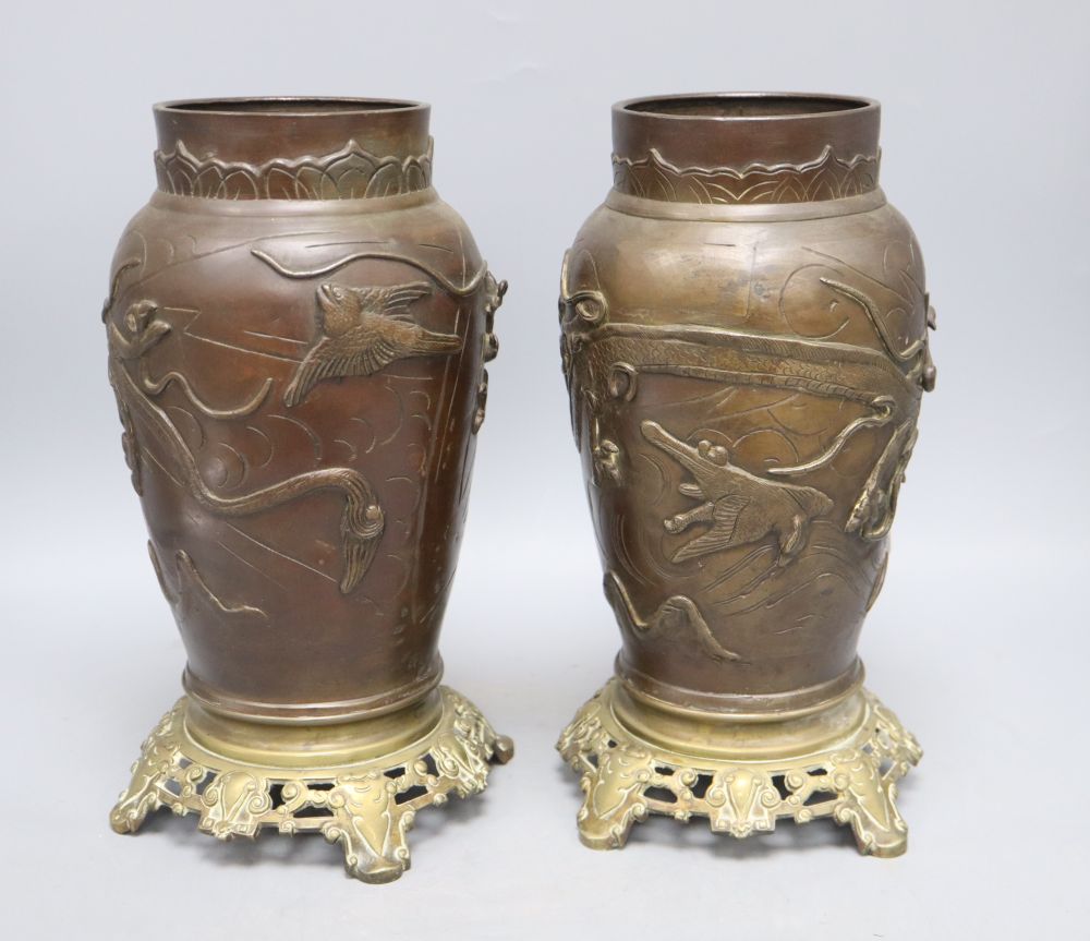 A pair of Japanese bronze vases with French bronze bases